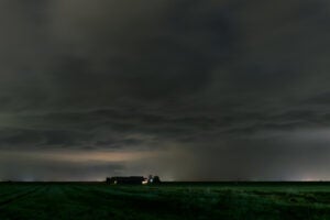 Dark threatening storm clouds over a farm