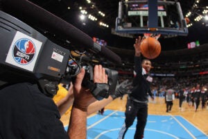 A camera man for ESPN films warm ups as the Miami Heat face the Denver Nuggets at the Pepsi Center