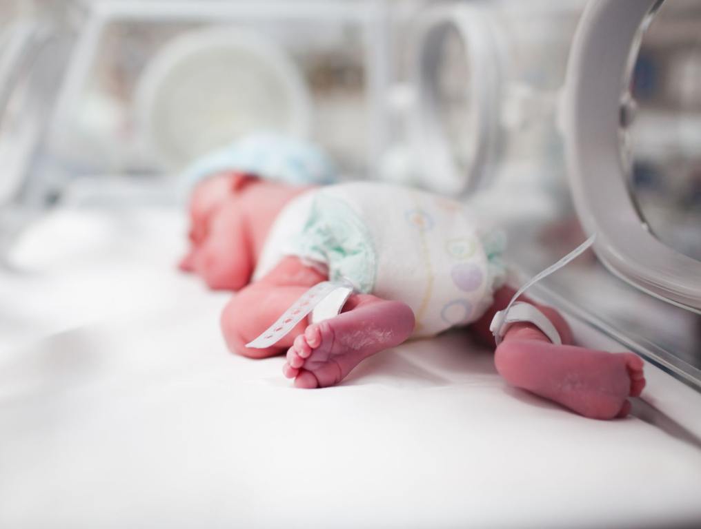 Baby in a hospital sleeping.