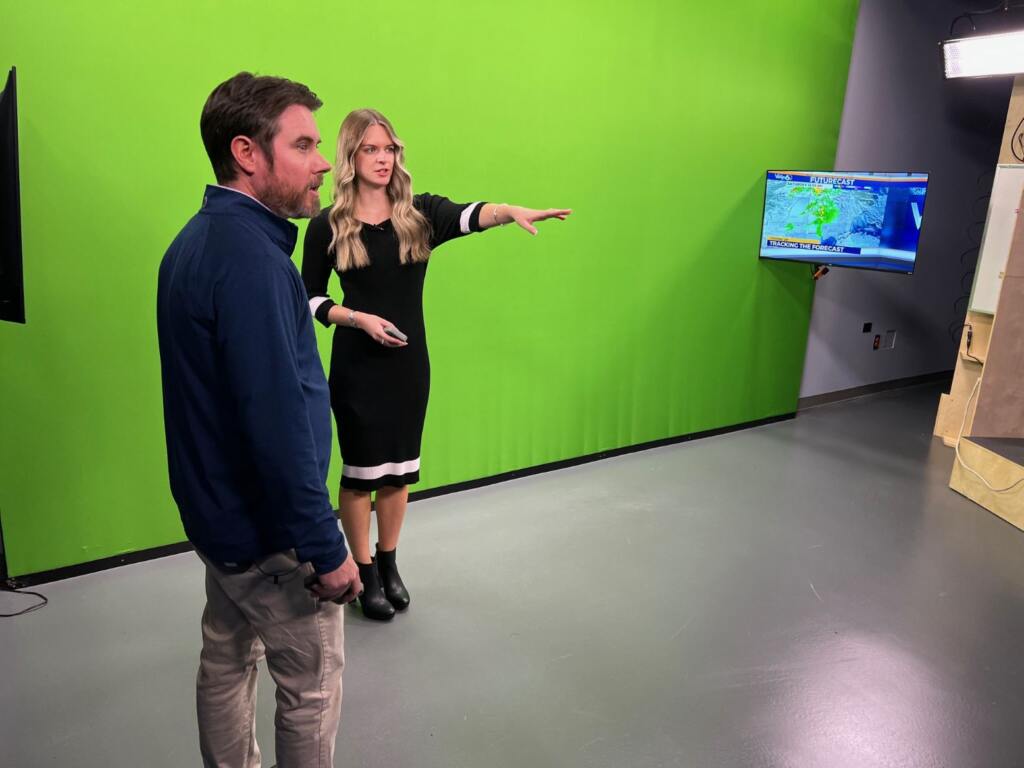 Bryan 'Dub' Axelson gets some green screen tips from WJBF NewsChannel 6 Chief Meteorologist Jenna Petracci before delivering a weather report with No Prep.